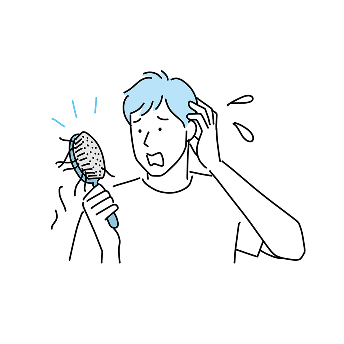 抜け毛に悩む男性の画像